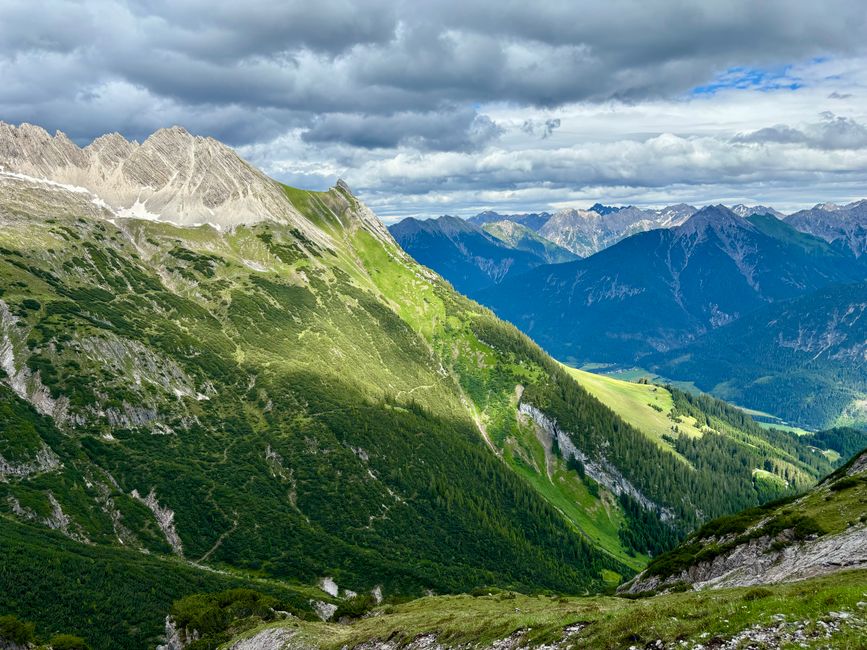 Vibrant view of green valleys and majestic mountain peaks in Hinterhornbach, Tyrol, Austria.