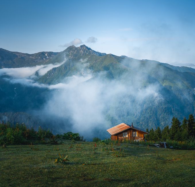 A serene mountain cabin surrounded by misty hills in Rize, Black Sea Region, Turkey.